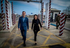 Germany's Foreign Minister Annalena Baerbock and Ukrainian counterpart Dmytro Kuleba walk at a Ukraine-Moldova border crossing point, on the second anniversary of Russia's invasion of Ukraine, in Odesa region, Ukraine, February 24, 2024. Eduard Kryzhanivskyi/Press Service of Ministry of Foreign Affairs of Ukraine/Handout via REUTERS