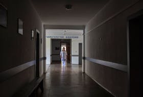Therapeutist Olena Belinska stands in a corridor of a local hospital, which was used by Russian troops during their occupation of the town of Balakliia, Ukraine September 11, 2023.