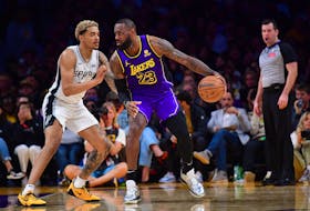 Feb 23, 2024; Los Angeles, California, USA; Los Angeles Lakers forward LeBron James (23) moves the ball against San Antonio Spurs forward Jeremy Sochan (10) during the second half at Crypto.com Arena. Mandatory Credit: Gary A. Vasquez-USA TODAY Sports