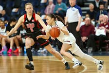 Saint Mary's Huskies guard dribbles against the defence of UNB Reds' Jayda Veinot during the AUS Final 6 women's basketball championship Sunday afternoon at Scotiabank Centre. SMU won its second straight conference title following a 64-49 victory. - Atlantic University Sport 
