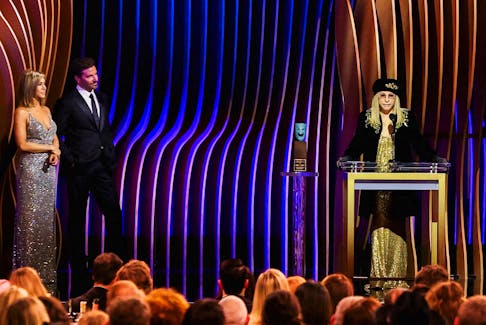 Barbra Streisand receives the SAG Life Achievement Award as Jennifer Aniston and Bradley Cooper looks on during the 30th Screen Actors Guild Awards, in Los Angeles, California, U.S., February 24, 2024.