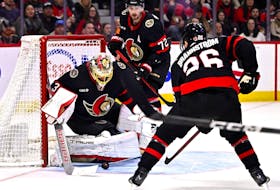 Ottawa Senators goaltender Anton Forsberg (31) settles a bouncing puck during first period NHL hockey action against the Vegas Golden Knights in Ottawa, on Saturday, Feb. 24, 2024.
