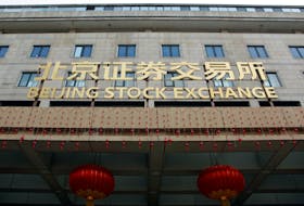 The sign of Beijing Stock Exchange is seen at its entrance during an organised media tour, in Beijing, China February 17, 2022.