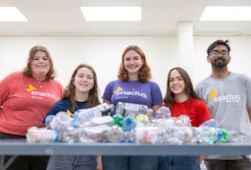 Some members of Memorial University’s Enactus team, from left, Allison Manning, Sophia White, Jenny Hilier, Sarah Moore and Roshik Rughoonauth, pose with some of the plastic bottles they use to produce 3D printer filament. – Contributed