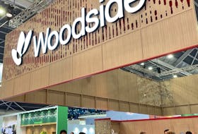 Gastech 2023 participants gather at Australia's Woodside Energy's booth in Singapore September 7, 2023.