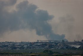 Smoke rises over the northern Gaza strip, as seen from Israel, February 26, 2024.