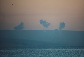 Smoke rises on the Lebanese side near the border with Israel, amid ongoing cross-border hostilities between Hezbollah and Israeli forces, as seen from Tyre, southern Lebanon December 2, 2023.