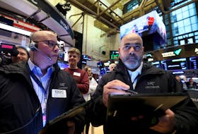 Traders work on the floor at the New York Stock Exchange (NYSE) in New York City, U.S., February 1, 2024. 