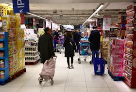 Customers shop at a Carrefour hypermarket in Paris, France, January 4, 2024.
