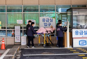 A patient is wheeled at The Catholic University of Korea, Seoul ST. Mary’s Hospital, ahead of the protests by doctors against the government's medical policy, in Seoul, South Korea, February 25, 2024.