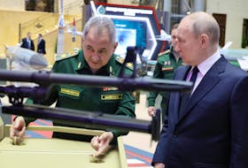 Russian President Vladimir Putin and Defence Minister Sergei Shoigu tour an exhibition of cutting-edge pieces of armament following an expanded meeting of the Defence Ministry Board at the National Defence Control Centre in Moscow, Russia December 19, 2023. Sputnik/Mikhail Klimentyev/Kremlin via