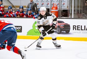 Charlottetown Islanders forward Anthony Flanagan, 14, carries the puck into the offensive zone in a Quebec Maritimes Junior Hockey League (QMJHL) game against the Moncton Wildcats on Feb. 25. Flanagan recorded two points and was named the third star in the Islanders’ 7-2 home-ice win before over 3,200 fans at Eastlink Centre. Ellison Media / Charlottetown Islanders