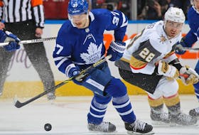 Timothy Liljegren of the Toronto Maple Leafs handles the puck against William Carrier of the Vegas Golden Knights at Scotiabank Arena on Nov. 2, 2021 in Toronto. 