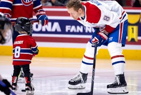 Canadiens defenceman Mike Matheson passes the puck with his son Hudson before the Canadiens' annual Skills Competition this past Sunday.