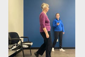 Zoomers physiotherapist, Heather MacAulay, uses her stopwatch while administering the Timed Up and Go (TUG) Test to measure her client Fran Nowakowski’s agility. Tracking a client's ability to do the TUG Test can help MacAulay identify if she is at high risk for falls. This knowledge helps her provide individualized guidance regarding which physical activities are safest and most appropriate for her. CONTRIBUTED
