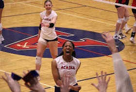Acadia Axewomen middle Wesley-Ann Bailey celebrates a point against the UNB Reds Feb. 26 in Atlantic University Sport volleyball semifinal action at Stu Aberdeen Court in Wolfville.  
Jason Malloy