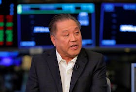 Hock Tan, CEO of Broadcom, speaks on the floor of the New York Stock Exchange shortly before the opening bell in New York, U.S., February 12, 2018.