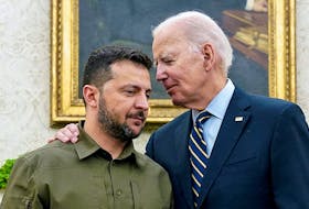 Ukrainian President Volodymyr Zelenskiy is embraced by U.S. President Joe Biden in the Oval Office of the White House in Washington on Sept. 21, 2023. Reuters file