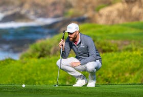 February 2, 2024; Pebble Beach, California, USA; Chris Kirk lines up his putt on the 10th hole during the second round of the AT&T Pebble Beach Pro-Am golf tournament at Pebble Beach Golf Links. Mandatory Credit: Kyle Terada-USA TODAY Sports/File Photo