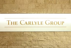 The logo of the Carlyle Group is displayed at the company's office in Tokyo, Japan October 17, 2018.