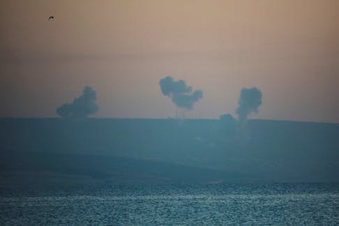 Smoke rises on the Lebanese side near the border with Israel, amid ongoing cross-border hostilities between Hezbollah and Israeli forces, as seen from Tyre, southern Lebanon December 2, 2023.