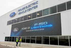 A banner for the all-new Ford F-150 Lightning electric pickup truck is seen outside the Rouge Electric Vehicle Center in Dearborn, Michigan, U.S., April 26, 2022.