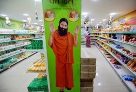 A hoarding with an image of Baba Ramdev is seen inside a Patanjali store in Ahmedabad, India, March 28, 2019. Picture taken March 28, 2019.