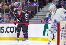Senators winger Vladimir Tarasenko celebrates his second period goal against the Toronto Maple Leafs with Shane Pinto, 57, at Canadian Tire Centre on Saturday. 