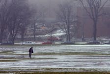 A man makes his way across an fog shrouded, ice-covered  Halifax Commons on Wednesday, January 9, 2008. Mild weather over the last few days has created treacherous conditions as pack snow has turned to ice. (Peter Parsons/staff