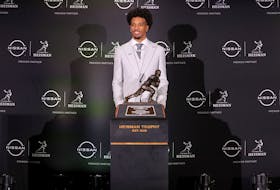 Dec 9, 2023; New York, New York, USA; LSU Tigers quarterback Jayden Daniels poses for photos with the Heisman trophy during a press conference in the Astor ballroom at the New York Marriott Marquis after winning the Heisman trophy. Mandatory Credit: Brad Penner-USA TODAY Sports/File Photo