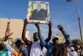 Supporters of Senegal's president Macky Sall march in support of him after the postponement of the  February 25 presidential election and ahead of a national dialogue proposed by Sall, in Dakar, Senegal February 24, 2024.