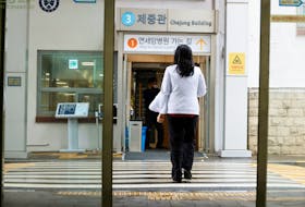 A medical worker walks at Severance Hospital in Seoul, South Korea, February 21, 2024.