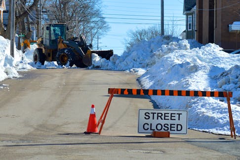 The Cape Breton Regional Municipality continued clearing sidewalks in south end Sydney on Tuesday. Several contractors have taken their equipment off the roads after learning the Cape Breton Regional Municipality is offering them substantially less than provincial rate for their equipment and labour. Chris Connors/Cape Breton Post
