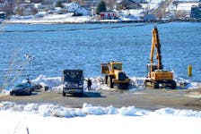 The Cape Breton Regional Municipality is still dumping snow into Sydney harbour following two major snowstorms earlier this month. Some contractors who withdrew contributions to the ongoing snow-clearing efforts question why the CBRM is paying to have an excavator with a clamshell bucket at the waterfront. “That would be for grabbing big boulders or logs — it's not for throwing snow in the ocean or throwing snow anywhere,” said Lawrence Ravanello, owner of Ravanello’s Rock Construction. Chris Connors/Cape Breton Post