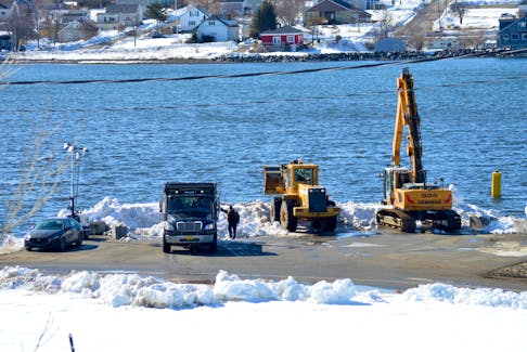 The Cape Breton Regional Municipality is still dumping snow into Sydney harbour following two major snowstorms earlier this month. Some contractors who withdrew contributions to the ongoing snow-clearing efforts question why the CBRM is paying to have an excavator with a clamshell bucket at the waterfront. “That would be for grabbing big boulders or logs — it's not for throwing snow in the ocean or throwing snow anywhere,” said Lawrence Ravanello, owner of Ravanello’s Rock Construction. Chris Connors/Cape Breton Post