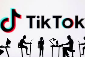 Figurines with computers and smartphones are seen in front of TikTok logo in this illustration taken, February 19, 2024.