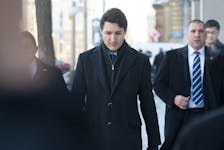 Prime Minister Justin Trudeau walks to the National Press Theatre in Ottawa to speak about the SNC Lavalin scandal on March 7, 2019.