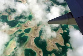 Lagoons can be seen from a plane as it flies above Kiritimati Island, part of the Pacific Island nation of Kiribati, April 5, 2016. 