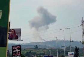 Smoke rises from a site believed to have been hit by an Israeli strike, in southern Lebanon, in this screen grab taken from a video, February 27, 2024. REUTERS TV via
