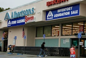 A woman enters an Albertson's grocery store in Glendale, California November 28, 2008.