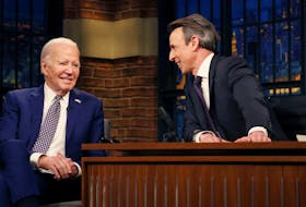 U.S. President Joe Biden laughs during a break in a taped TV interview on NBC's "Late Night With Seth Meyers" in New York City, U.S., February 26, 2024.