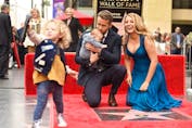  Ryan Reynolds and Blake Lively pose with their daughters at his star on the Hollywood Walk of Fame on Dec. 15, 2016.