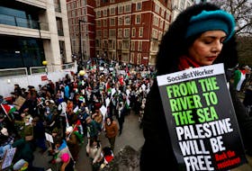 People take part in a protest to mark 100 days since the start of the ongoing conflict between Israel and the Palestinian Islamist group Hamas in Gaza during a march in London, Britain, January 13, 2024.