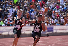 Apr 1, 2023; Austin, TX, USA; Christopher Morales-Williams takes the handoff from Matthew Boling on the third leg of the Georgia Bulldogs 4 x 200m relay that won in a meet record 1:20.22 during the 95th Clyde Littlefield Texas Relays at Mike A. Myers Stadium. Mandatory Credit: Kirby Lee-USA TODAY Sports/File Photo
