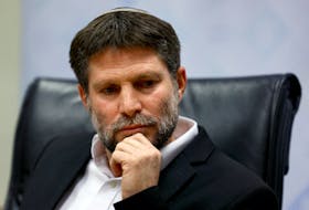Israeli Finance Minister Bezalel Smotrich attends a news conference after announcing that he will sign an order to seize Palestinian Authority funds and transfer them to the families of victims of Palestinian attacks, at Israel's Finance Ministry in Jerusalem, January 8, 2023.