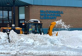 A Cape Breton Regional Municipality plow clears the walkway in front of the James McConnell Memorial Library in Sydney on Wednesday. Cleanup efforts continued around the municipality days after a massive snowstorm buried the area in more than a metre of snow. Many roads around Sydney's downtown have been cleared, while many streets in outer areas are still buried. LUKE DYMENT/CAPE BRETON POST
