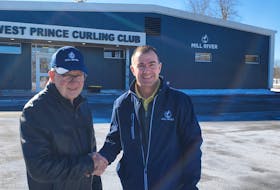 Clair Sweet, left, president of the West Prince Curling Club at Mill River, and Dean Sherman, the facility’s general manager, congratulate each other outside the newly opened rink. The new curling club has been in the works for several years and resulted from groups in O’Leary and Alberton combining and sharing resources. Colin MacLean