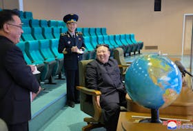 North Korea's leader Kim Jong-un visits the Pyongyang General Control Centre of the National Aerospace Technology Administration to inspect operational readiness of the reconnaissance satellites and view aerospace photographs, in this picture released by the Korean Central News Agency on November 25, 2023. KCNA via
