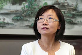 Lawyer Hong Guo poses for a photo in her office in Richmond on November 9, 2016.  