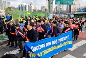South Korean doctors march to protest against the government medical policy in front of the Presidential office in Seoul, South Korea, February 25, 2024.